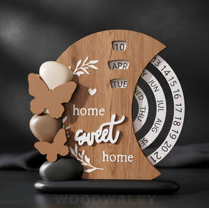 Wooden decorative item with 'home sweet home' text and calendar design on a dark background