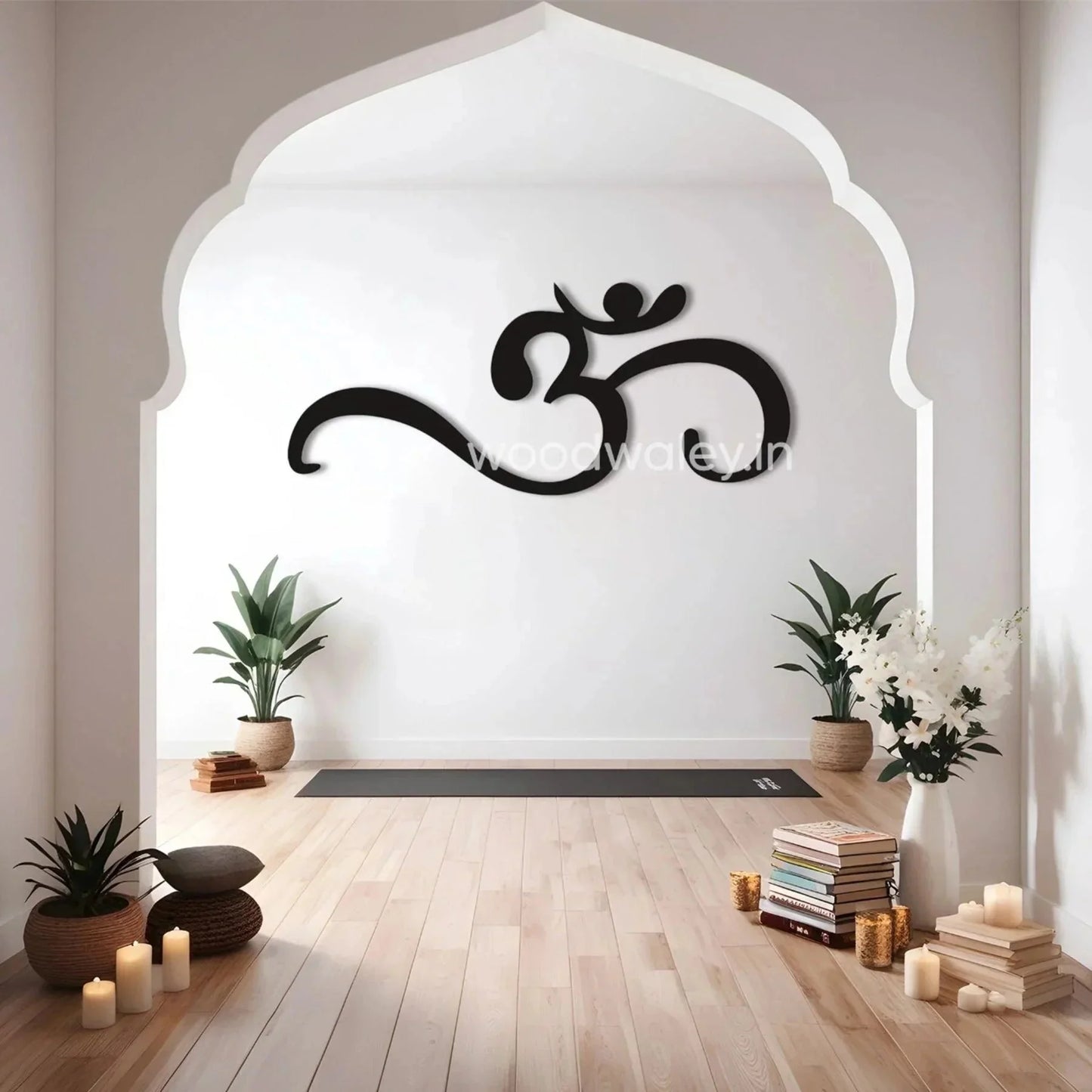 Minimalist home decor with large Om wooden wall art, potted plants, candles, and yoga mat