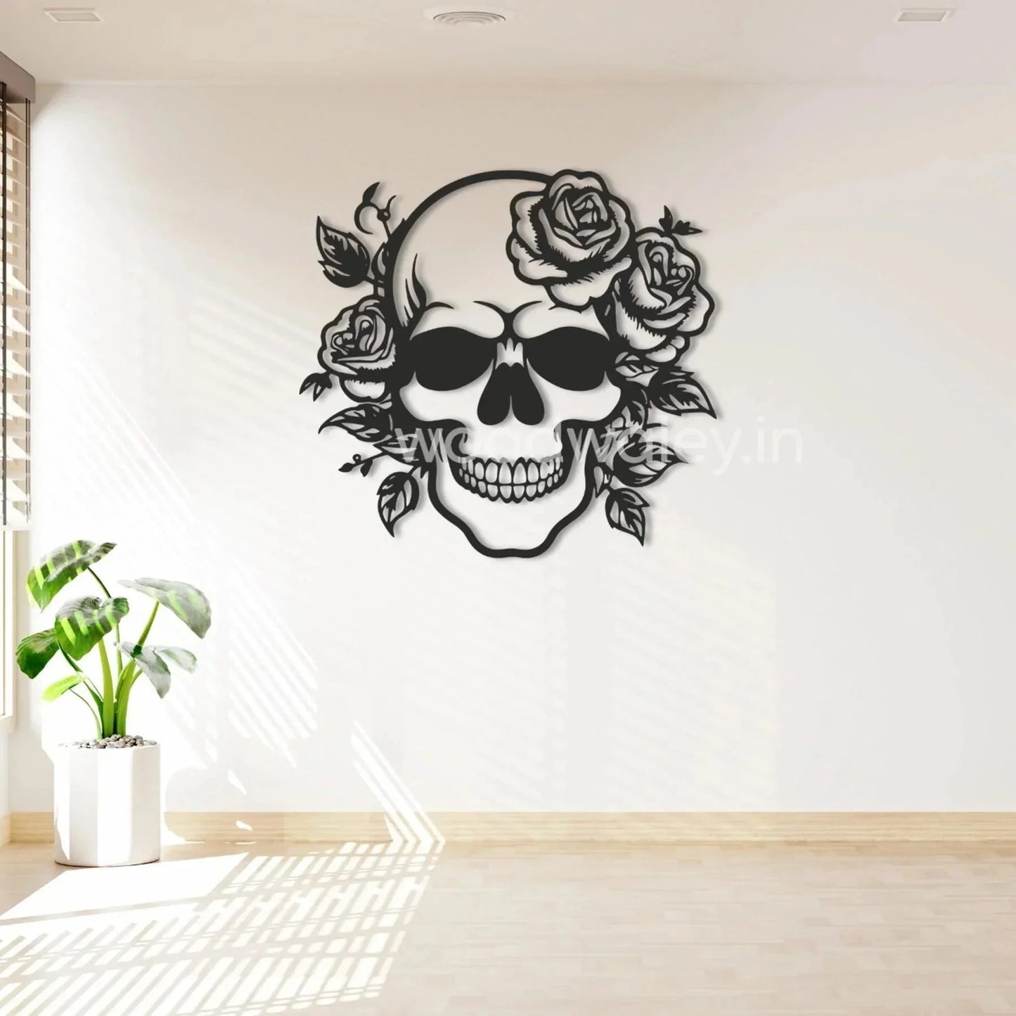 Modern living room with black wooden skull and floral wall decor art, sunlight streaming in