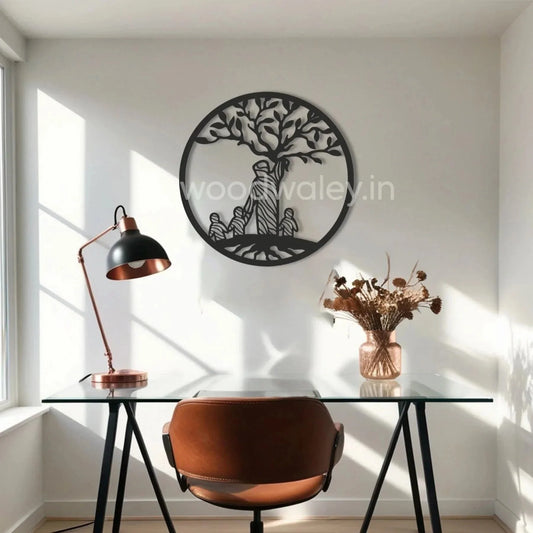 Modern home office with glass desk, brown chair, black desk lamp, and wooden family tree wall art.