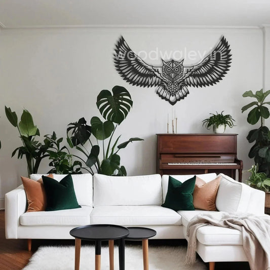 Modern living room with white sofa, large wooden owl wall decor, piano, and green indoor plants
