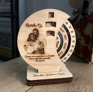 Wooden decorative item with engraved photo and text on a wooden surface