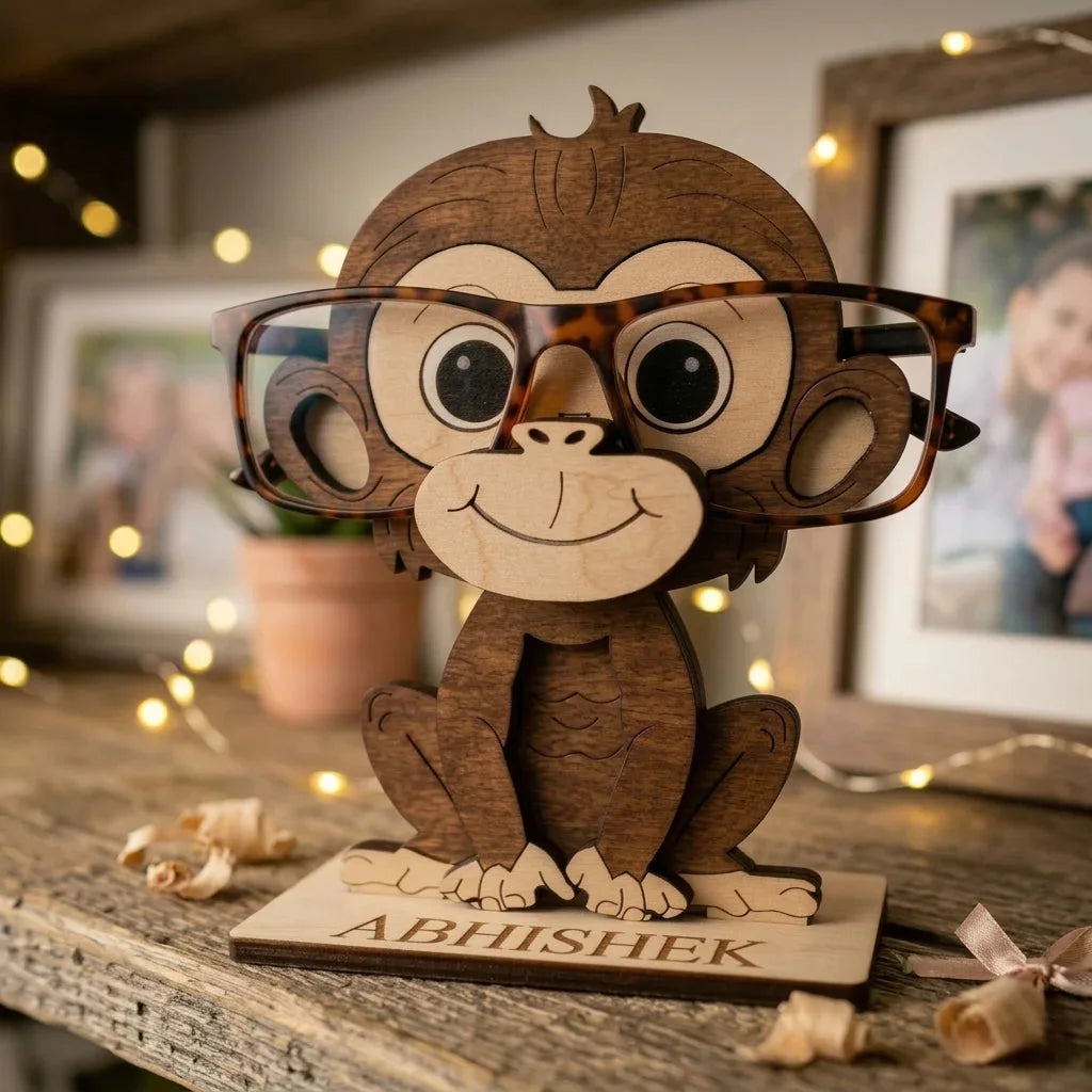 Wooden monkey figurine with glasses on a wooden surface with blurred background