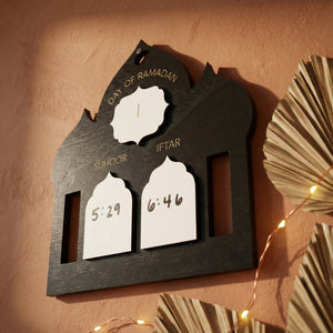 Wooden Ramadan calendar with time display on a warm-toned background