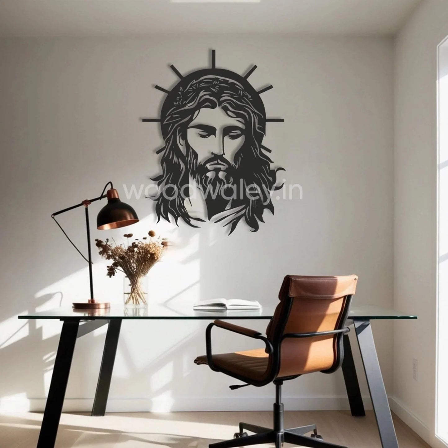 Handcrafted wooden wall art of Jesus with halo in a modern home office with glass desk