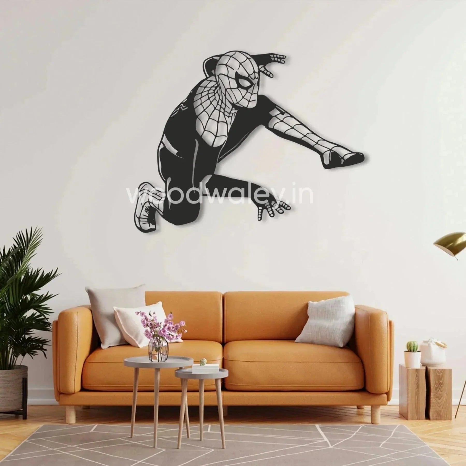 Decorative wall art of a superhero silhouette above a modern sofa in a stylish living room.