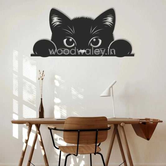 Handcrafted black wooden cat wall decor above minimalist wooden desk in modern home office