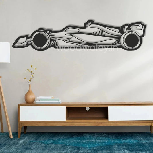 Wooden race car wall art decor above a modern console table in a minimalist living room